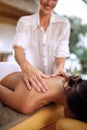 Female receiving a massage in a spa close up Royalty Free Stock Photo