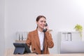 Female receptionist talking on phone at workplace Royalty Free Stock Photo