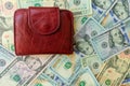 Women`s wallet on dolar notes. Royalty Free Stock Photo