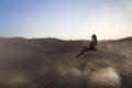 Female relaxing on the sand dune, admiring the oasis town of Huacachina, Ica, Peru.The sunset desert view Royalty Free Stock Photo