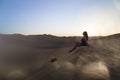 Female relaxing on the sand dune, admiring the oasis town of Huacachina, Ica, Peru.The sunset desert view Royalty Free Stock Photo
