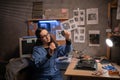 Female repairman disassembling laptop motherboard, holding a cooler fan in her hand. Technician repairing broken laptop