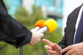 Female reporter conducting media interview with businessman or politician Royalty Free Stock Photo