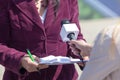 Female reporter holding microphone, interviewing woman