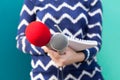 Female reporter at news conference, taking notes, holding microphones Royalty Free Stock Photo