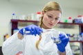 Female researcher carrying out research in a physics/chemistry lab Royalty Free Stock Photo