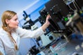 Female researcher carrying out research in a physics/chemistry lab Royalty Free Stock Photo