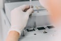 Female researcher doing research in a chemistry lab. Gas chromatograph