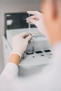 Female researcher doing research in a chemistry lab. Gas chromatograph