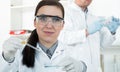 Female researcher with glass equipment in the lab