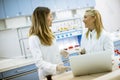 Female researchers in white lab coat using laptop while working in the laboratory Royalty Free Stock Photo