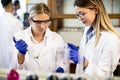 Female researchers in white lab coat working in the laboratory