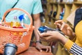 female retail store merchant using a mobile point of sale system to process payment from a customer Royalty Free Stock Photo