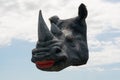 Female Rhino head isolate on bluesky clouds.