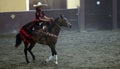 Female rider in black and red dress