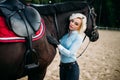 Female rider hugs her horse, horseback riding Royalty Free Stock Photo