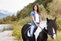 Female rider sitting on her horse and smiling Royalty Free Stock Photo