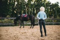 Female rider trains her horse, horseback riding Royalty Free Stock Photo