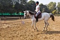 Female rider trains the horse Royalty Free Stock Photo