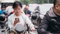 Female riding motorcycle in the street, people's life during pandemic in Shanghai