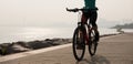 riding mountain bike on seaside Royalty Free Stock Photo