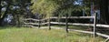 Split Rail Fence in Front of Stately Brick Home