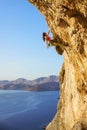 Female rock climber on challenging route