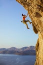 Female rock climber falling off cliff while lead climbing Royalty Free Stock Photo