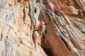 Female rock climber on handholds on challenging route on cliff Royalty Free Stock Photo