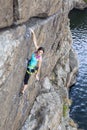 Female rock climber hanging over the abyss Royalty Free Stock Photo