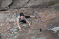 Female rock climber hanging over the abyss Royalty Free Stock Photo