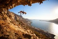 Female rock climber hanging on rope on cliff Royalty Free Stock Photo