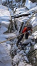 Female rock climber rappelling in the Swiss Alps Royalty Free Stock Photo