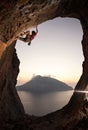 Female rock climber at sunset, Kalymnos, Greece