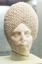 Female Roman Head with complicated curly hairstyle
