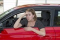 Female rookie new driver young beautiful woman scared and stressed while driving car in fear and shock Royalty Free Stock Photo