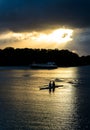 Female Rowers on Sunset Lake Royalty Free Stock Photo