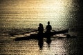 Female Rowers on Sunset Lake Royalty Free Stock Photo