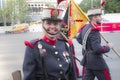 Female Royal Guard talking to photographers