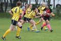 Female rugby players in action