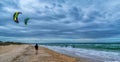 Female runner and kite surfers Royalty Free Stock Photo