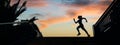 Female runner silhouette running over urban background with palm trees and sunset sky Royalty Free Stock Photo