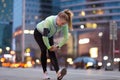 Female runner stretching before jog