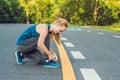 Female runner tying her shoes preparing for jogging outside .Young girld runner getting ready for training. Sport