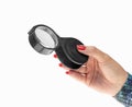 Female`s hand with black loupe isolated
