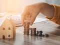 Female`s hand put coin stack money staircase on table, Business Growth concept, Financial risk. for plan saving finance money Royalty Free Stock Photo