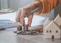 Female`s hand put coin stack money staircase on table, Business Growth concept, Financial risk. for plan saving finance Royalty Free Stock Photo