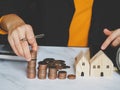 Female`s hand put coin stack money staircase on table, Business Growth concept, Financial risk. for plan saving finance Royalty Free Stock Photo