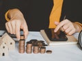 Female`s hand put coin stack money staircase on table, Business Growth concept, Financial risk. for plan saving finance Royalty Free Stock Photo