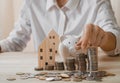 Female`s hand put coin stack money staircase on table, Business Growth concept, Financial risk. for plan saving finance Royalty Free Stock Photo